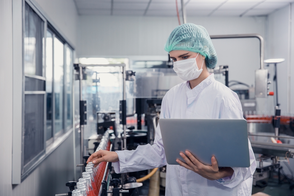 food and drink industry staff worker working at a conveyor belt production line