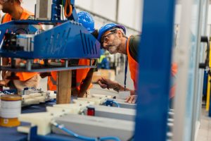 Engineer inspecting industrial pneumatic conveying equipment